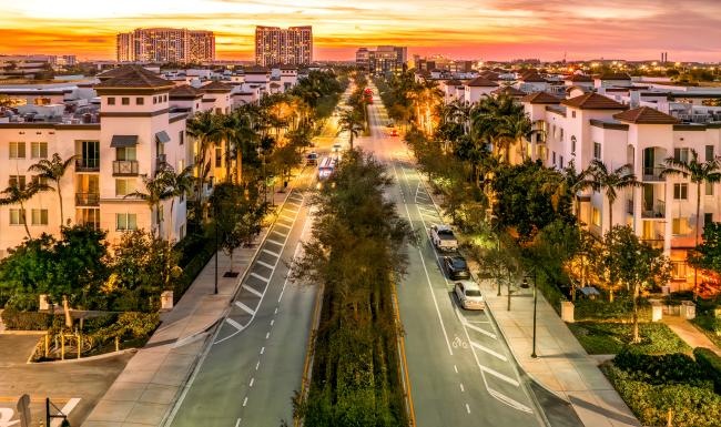 Find your perfect fit at Cordoba a street with cars and trees on it with buildings in the back
